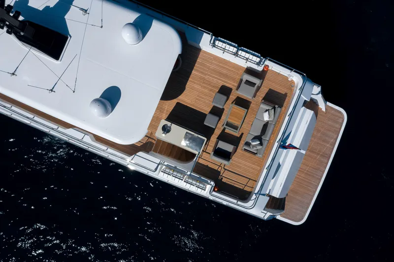 Slide: The Image of Aerial view of 2025 Nomad 95 SUV yacht with spacious deck and seating area. - 39