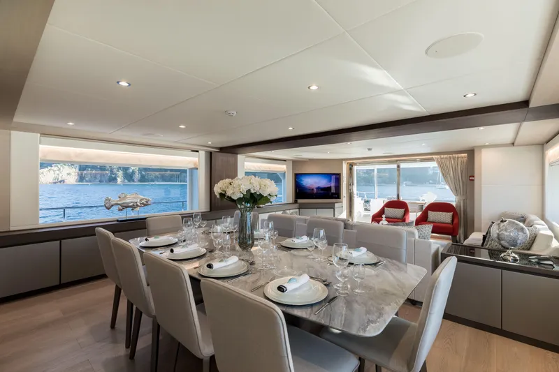 Slide: The Image of Luxurious interior of 2025 Nomad 95 SUV yacht with elegant dining area and scenic views. - 6