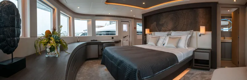 Slide: The Image of Luxurious bedroom interior of 2025 Nomad 95 SUV yacht with modern design and large windows. - 7