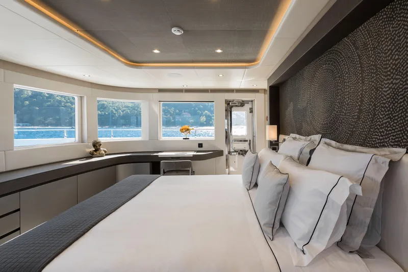 Slide: The Image of Luxurious bedroom interior of 2025 Nomad 95 SUV yacht with scenic ocean view. - 9