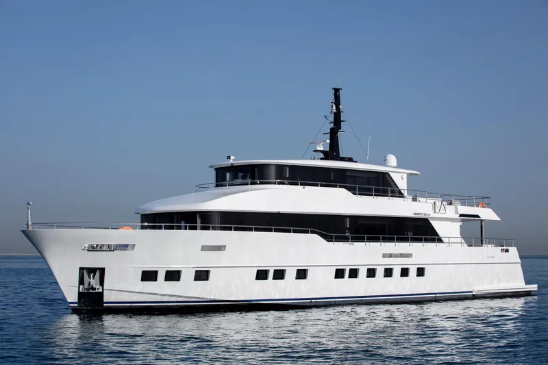 Slide: The Image of Luxury Nomad 95 SUV yacht cruising on calm waters, 2025 model. - 28