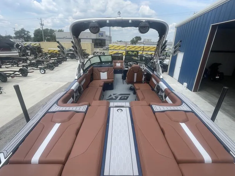 Slide: The Image of 2023 MasterCraft XT24 boat with spacious seating and modern design. - 8