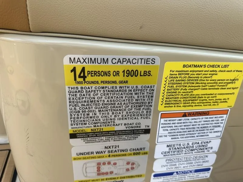 Slide: The Image of 2024 MasterCraft NXT21 capacity label: 14 persons or 1900 lbs. - 11