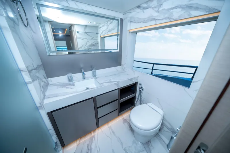 Slide: The Image of Luxurious bathroom in 2025 Nomad 75 SUV yacht with marble design and ocean view. - 13