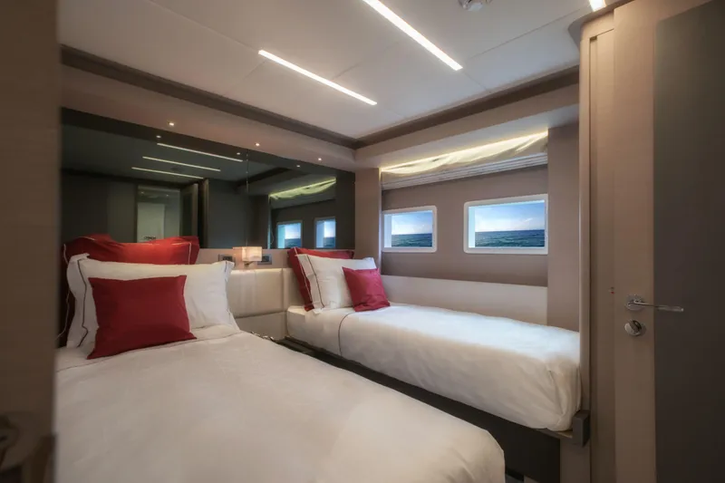 Slide: The Image of Luxurious bedroom interior of 2025 Nomad 75 SUV yacht with twin beds and modern decor. - 14