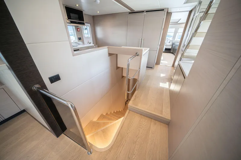 Slide: The Image of Luxurious interior of 2025 Nomad 75 SUV yacht with modern staircase and sleek design. - 20