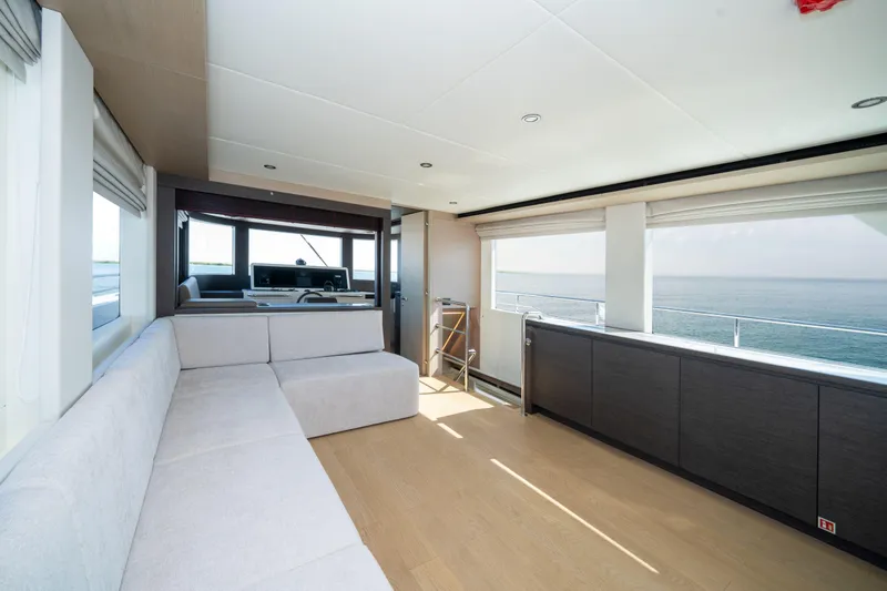 Slide: The Image of Luxurious interior of 2025 Nomad 75 SUV yacht with ocean view and modern seating. - 5