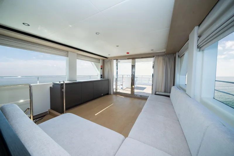 Slide: The Image of Luxurious interior of 2025 Nomad 75 SUV yacht with panoramic ocean views. - 6