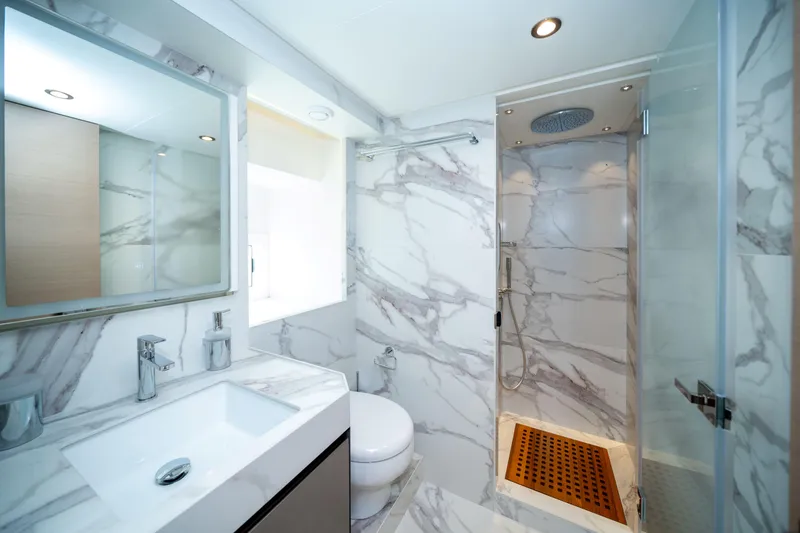 Slide: The Image of Luxurious marble bathroom interior in 2025 Nomad 75 SUV, featuring modern fixtures and spacious shower. - 11