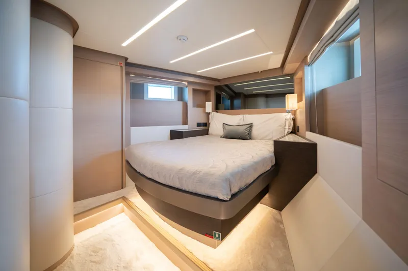 Slide: The Image of Luxurious bedroom interior of 2025 Nomad 75 SUV yacht with modern design and ambient lighting. - 12
