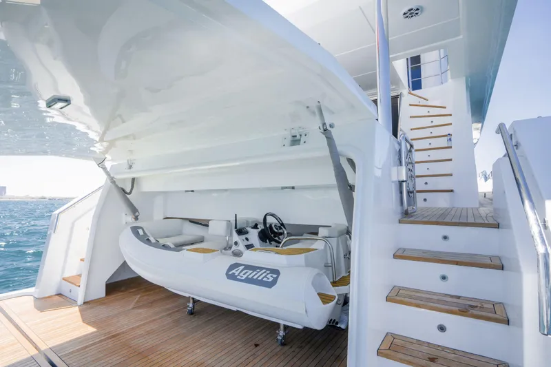 Slide: The Image of Luxury Nomad 75 SUV yacht with tender storage, showcasing modern design and functionality, 2025 model. - 27