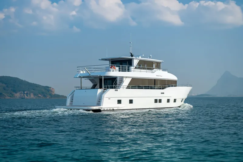 Slide: The Image of Luxury Nomad 75 SUV yacht cruising on open sea, 2025 model. - 30