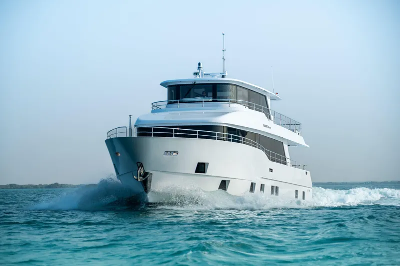 Slide: The Image of 2025 Nomad 75 SUV yacht cruising on open water. - 32