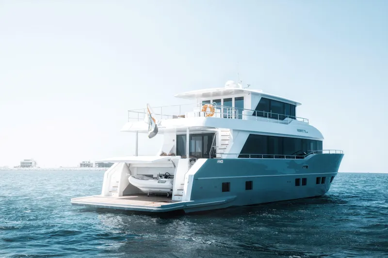 Slide: The Image of Luxurious 2025 Nomad 75 SUV yacht cruising on open sea. - 33