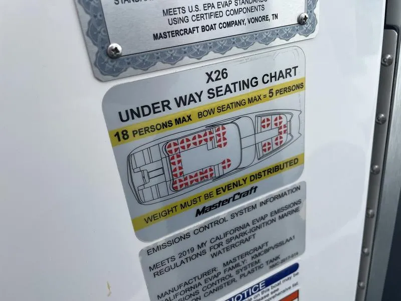 Slide: The Image of 2019 MasterCraft X26 under way seating chart with capacity and weight distribution guidelines. - 20