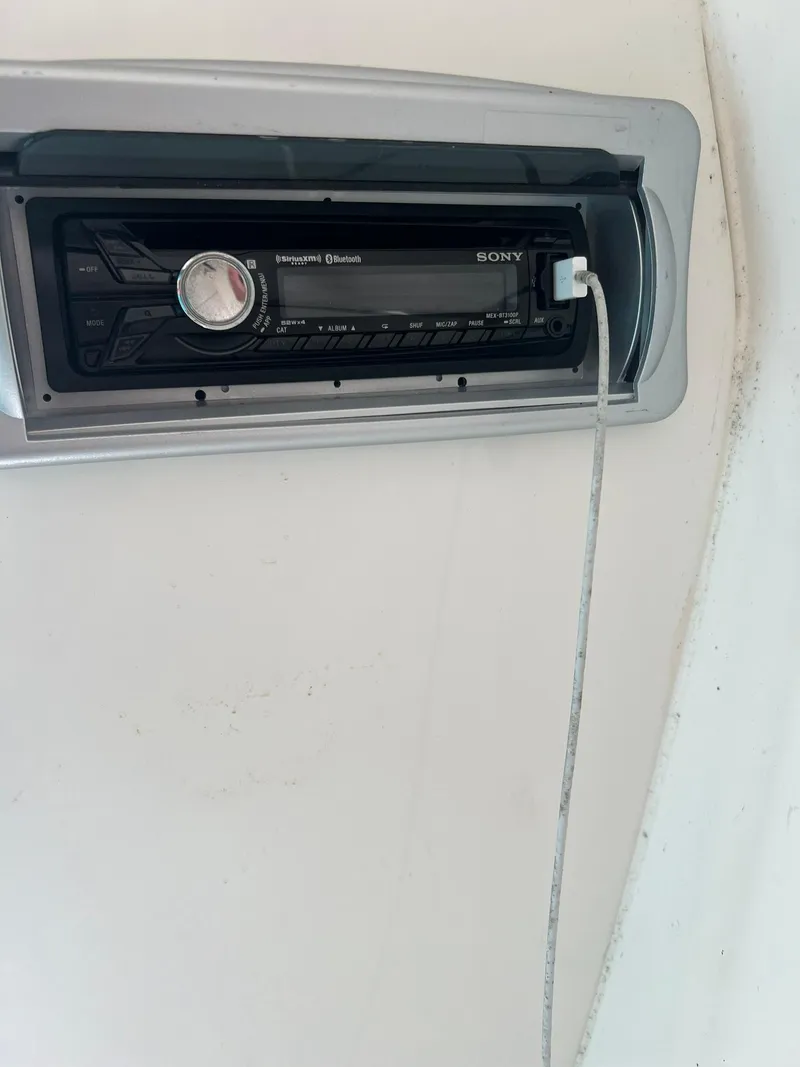 Slide: The Image of Sony stereo system in a 2014 Rinker 246 Captiva Bowrider boat. - 13