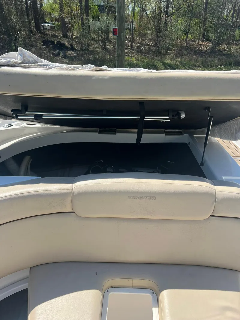 Slide: The Image of 2014 Rinker 246 Captiva Bowrider with open engine compartment. - 17