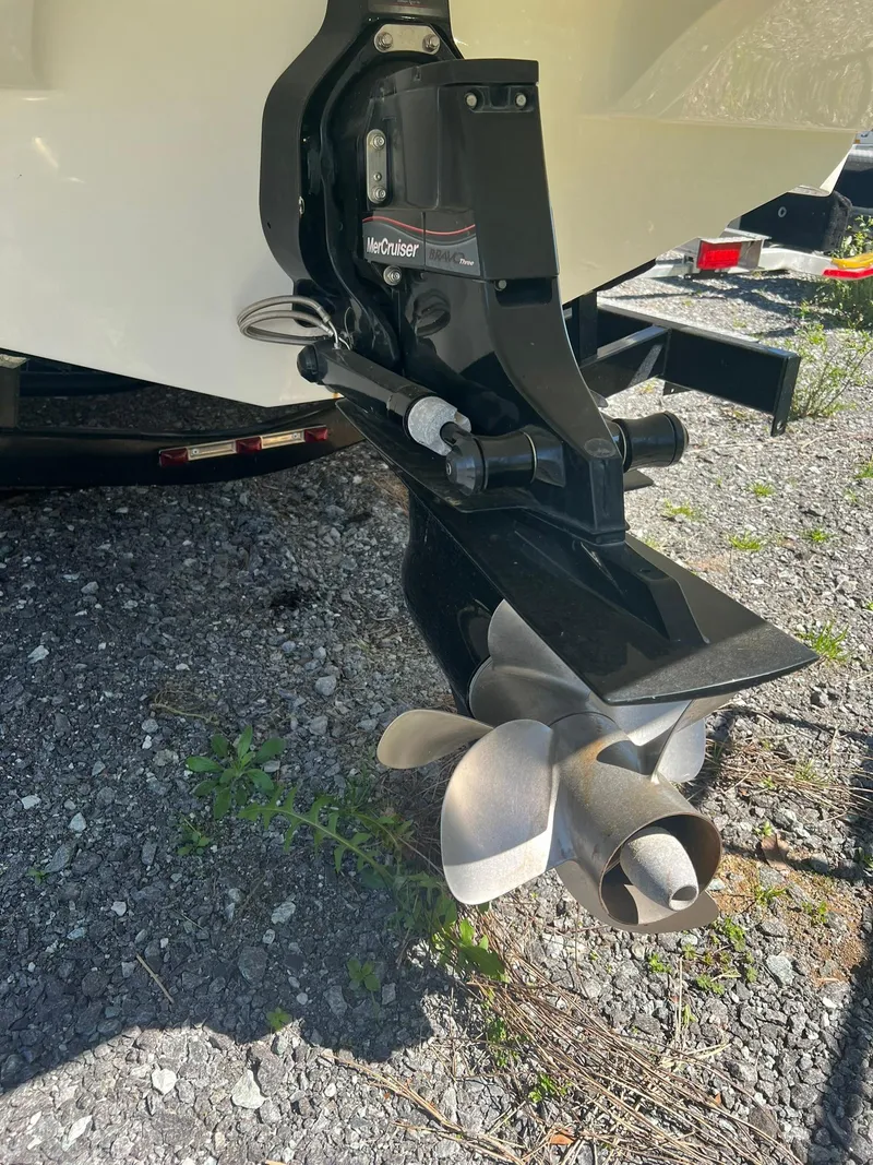Slide: The Image of Close-up of 2014 Rinker 246 Captiva Bowrider boat propeller and stern drive. - 21