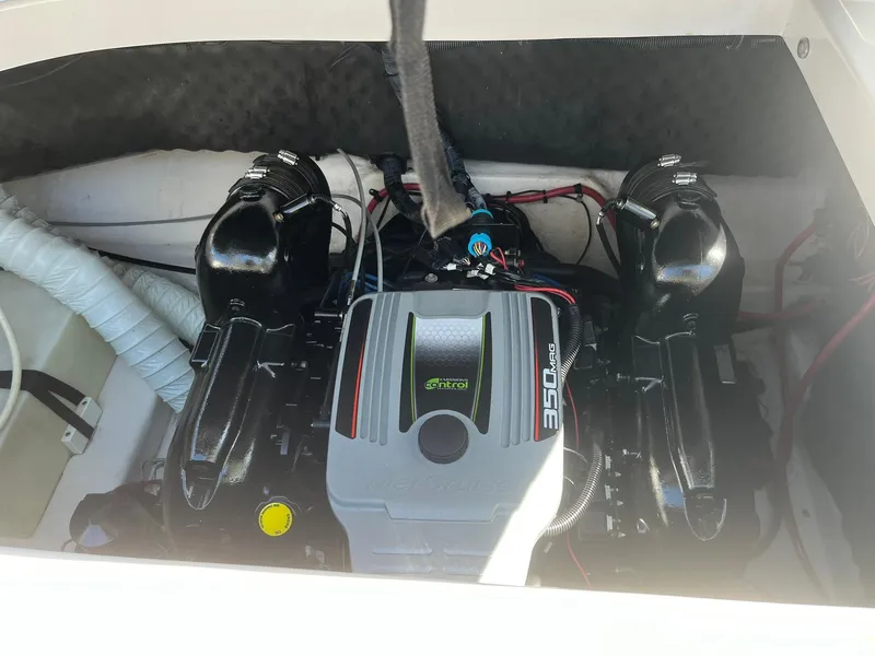 Slide: The Image of 2014 Rinker 246 Captiva Bowrider engine compartment with 350 MAG motor. - 24