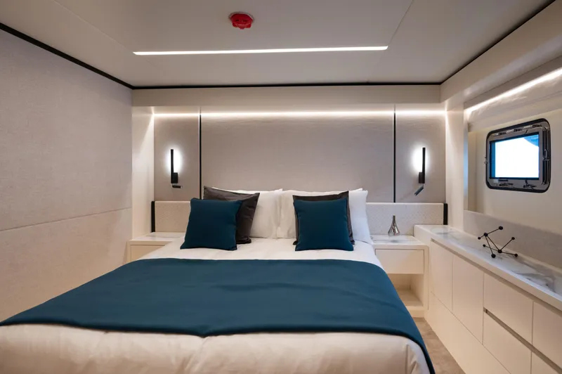 Slide: The Image of Luxurious bedroom interior of 2025 Nomad 70 SUV yacht with modern design and ambient lighting. - 14