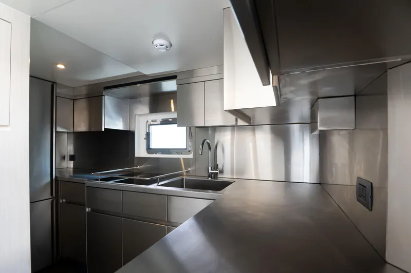 Slide: The Image of Modern stainless steel kitchen in 2025 Nomad 70 SUV yacht. - 16
