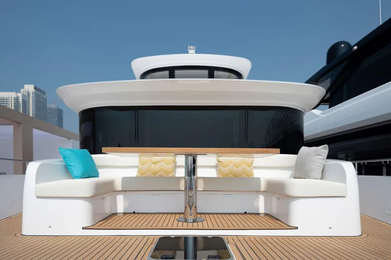 Slide: The Image of Luxury seating area on 2025 Nomad 70 SUV yacht with colorful cushions. - 19