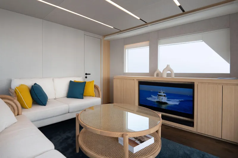 Slide: The Image of Luxurious interior of 2025 Nomad 70 SUV yacht with modern decor and comfortable seating. - 7