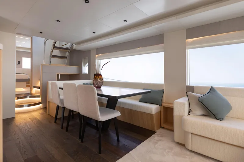 Slide: The Image of Luxurious interior of 2025 Nomad 70 SUV yacht with elegant dining area and modern design. - 8