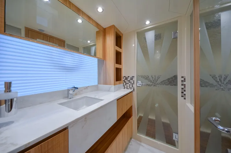 Slide: The Image of Luxurious bathroom interior in 2025 Nomad 65 yacht with modern fixtures and elegant design. - 12