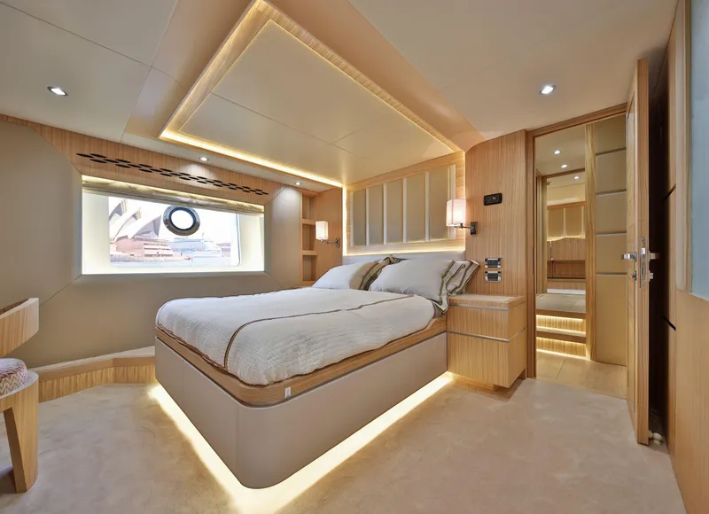 Slide: The Image of Luxurious bedroom interior on 2025 Nomad 65 yacht, featuring modern design and ambient lighting. - 5