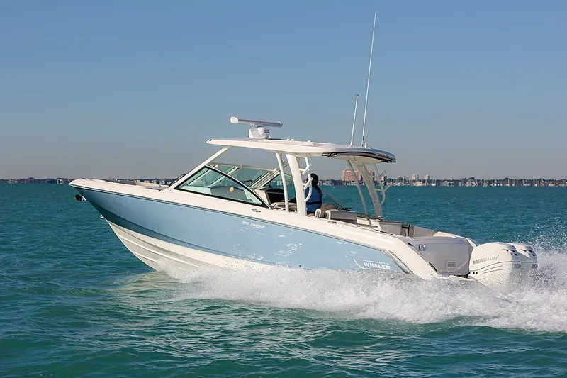 Slide: The Image of 2018 Boston Whaler 320 Vantage cruising on open water. - 9