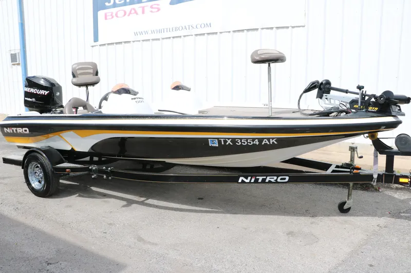 Slide: The Image of 2007 Nitro NX 591 DC fishing boat on trailer with Mercury outboard motor. - 13