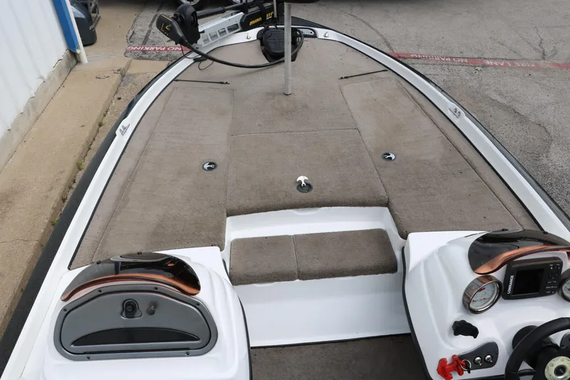 Slide: The Image of 2007 Nitro NX 591 DC boat deck with carpeted flooring and control panels. - 16