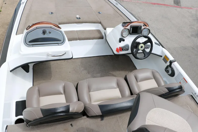 Slide: The Image of 2007 Nitro NX 591 DC boat interior with steering wheel and seating. - 21