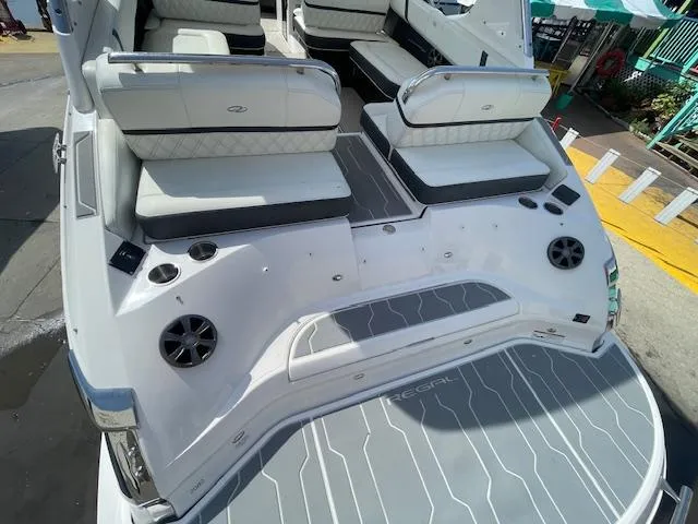 Slide: The Image of 2020 Regal 2800 boat with white and gray seating and deck. - 10