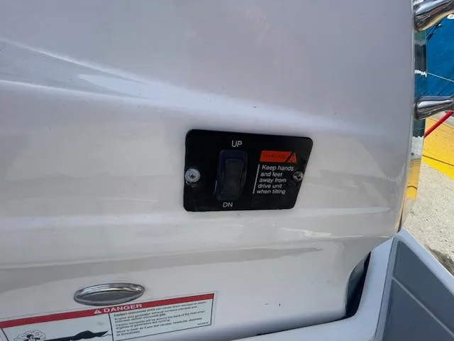 Slide: The Image of Close-up of a 2020 Regal 2800 boat control panel with safety warning. - 12