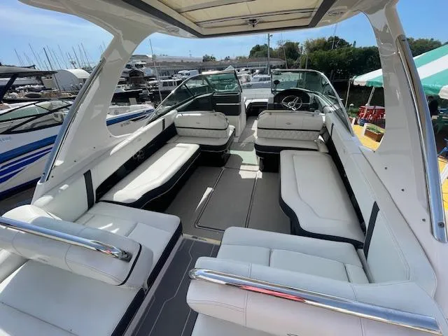 Slide: The Image of 2020 Regal 2800 boat interior with white seating and open deck. - 16