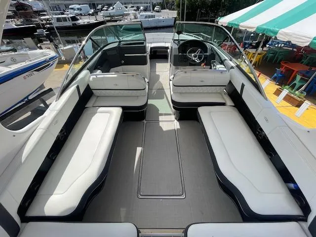 Slide: The Image of 2020 Regal 2800 boat interior with white seating and steering wheel. - 22