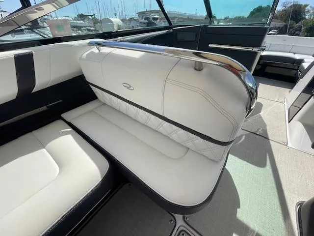 Slide: The Image of 2020 Regal 2800 boat interior with white leather seating and stainless steel accents. - 24