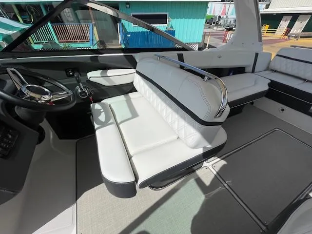Slide: The Image of Interior of a 2020 Regal 2800 boat with white leather seating. - 25