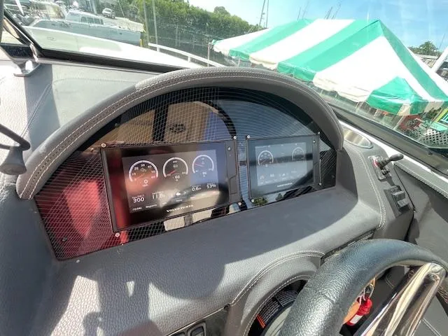 Slide: The Image of Dashboard of a 2020 Regal 2800 boat with digital displays. - 30