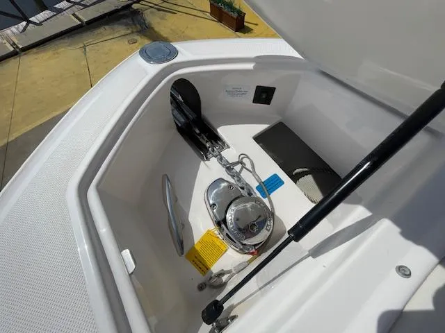 Slide: The Image of Anchor compartment of a 2020 Regal 2800 boat with anchor and winch. - 39