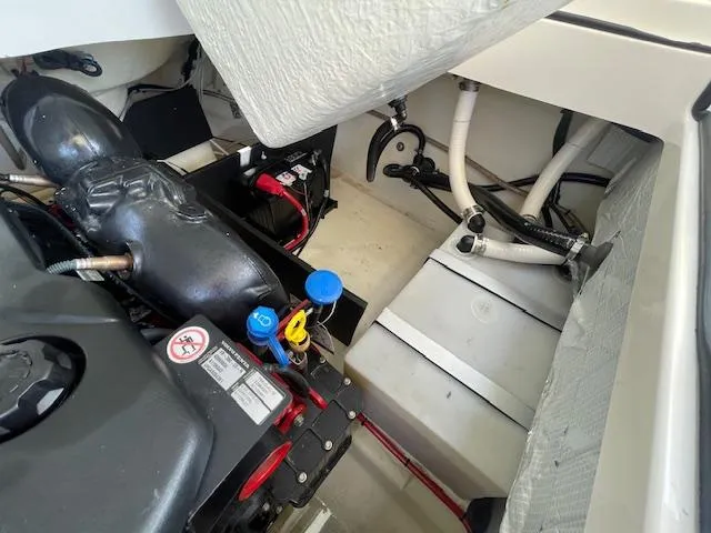 Slide: The Image of Engine compartment of a 2020 Regal 2800 boat showing engine and battery. - 44
