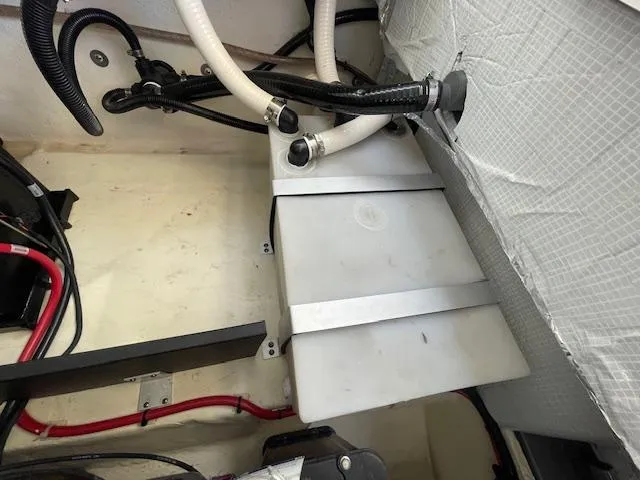 Slide: The Image of Engine compartment of a 2020 Regal 2800 boat with wiring and hoses. - 49