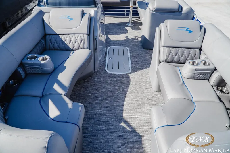 Slide: The Image of Luxurious interior of 2023 Bennington 24LXSB pontoon boat with plush seating. - 13