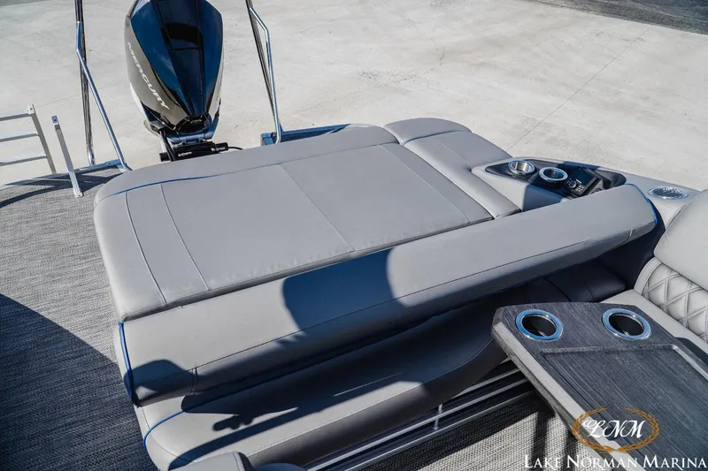 Slide: The Image of 2023 Bennington 24LXSB pontoon boat with spacious sun deck and cup holders. - 16
