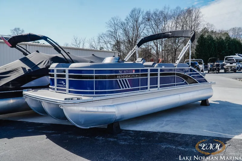 Slide: The Image of 2023 Bennington 24LXSB pontoon boat at Lake Norman Marina. - 2