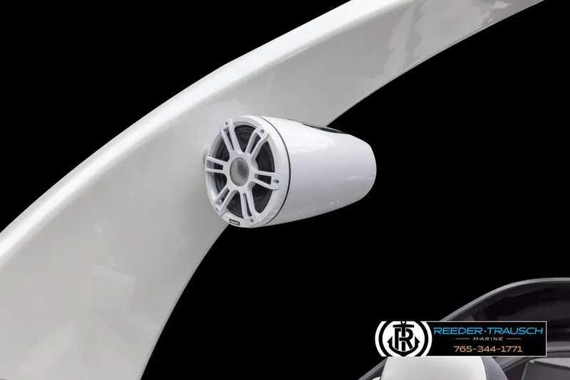 Slide: The Image of 2024 Avalon Excalibur VRB boat speaker on white arch, Reeder-Trausch Marine logo. - 11