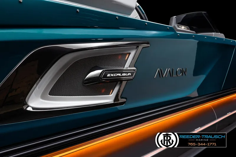 Slide: The Image of 2024 Avalon Excalibur VRB boat side view with branding and Reeder-Trausch Marine logo. - 16