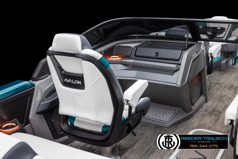 Slide: The Image of 2024 Avalon Excalibur VRB boat interior with modern seating and dashboard. - 6